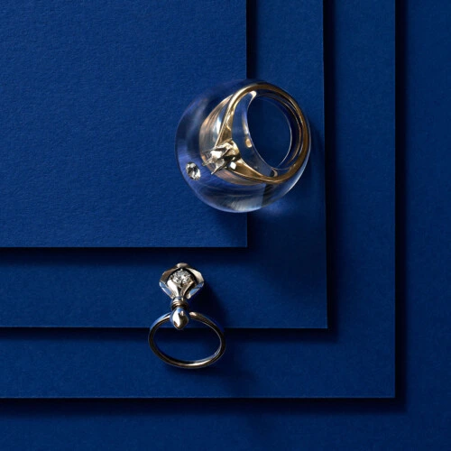 two diamond rings on a blue background