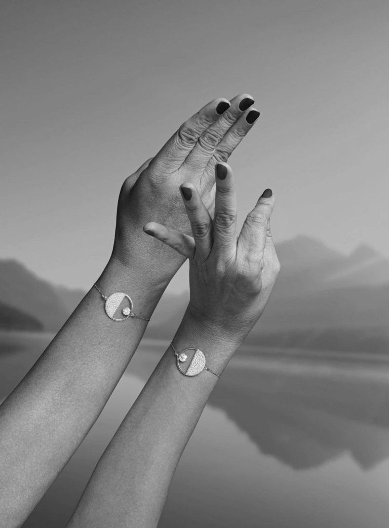 Two hand comparing bracelets