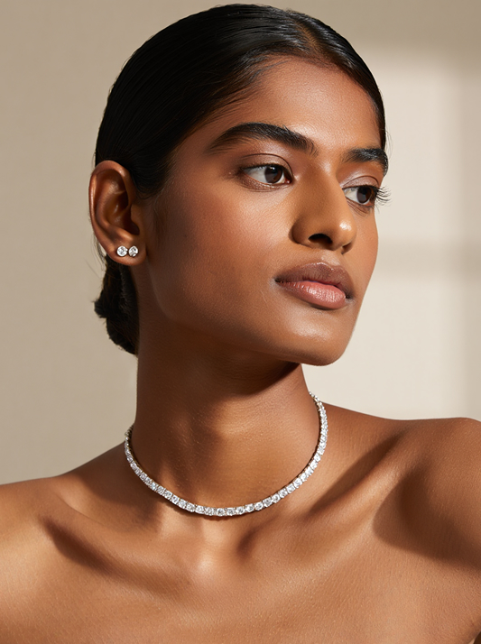 A model wearing a natural diamond choker and diamond studs