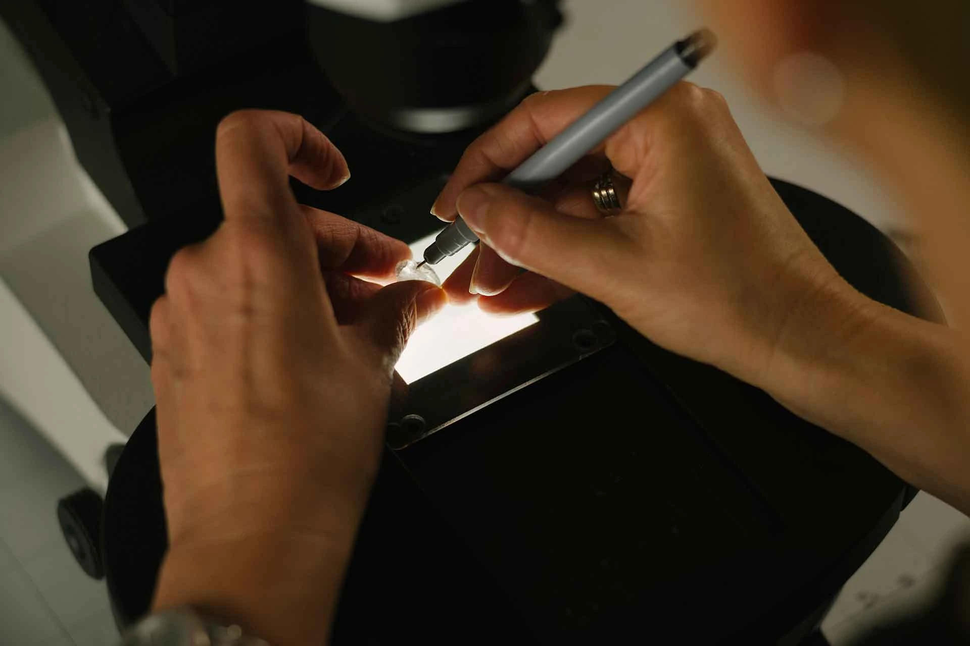 A person handing a rough diamond