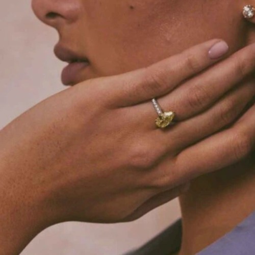 Woman wearing a natural diamond engagement ring