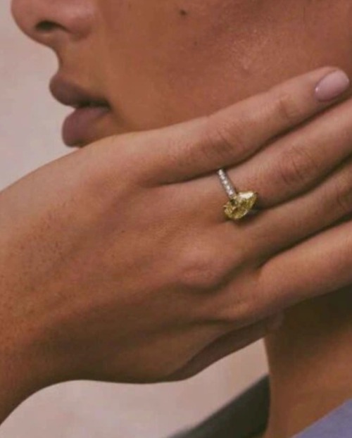 Woman wearing a natural diamond engagement ring