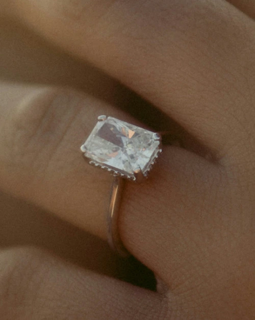 Close up of an engagement ring with a diamond solitaire