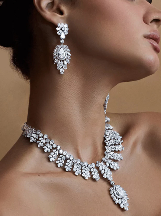 Close up of a model wearing a natural diamond necklace and earring set
