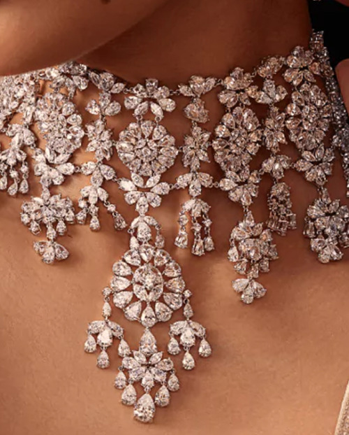 A bride wearing an ornate natural diamond necklace