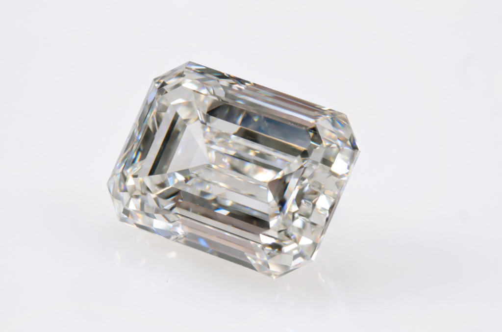 A close up of a brilliant emerald cut diamond