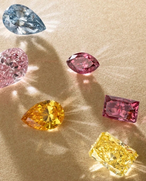 Six fancy coloured diamonds in different shapes and sizes