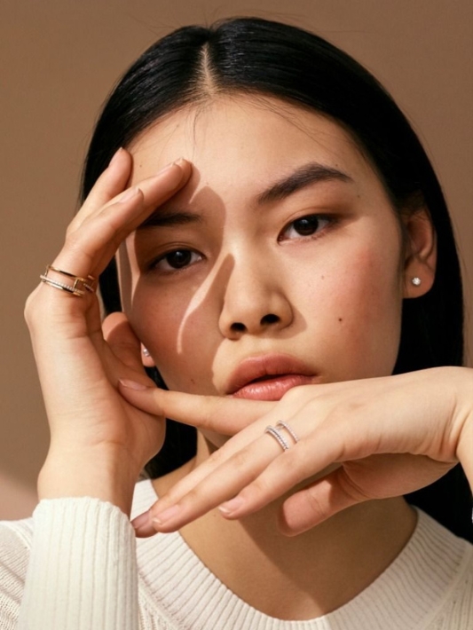 Model wearing natural diamond rings