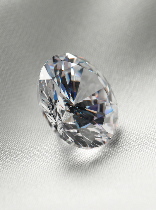 A close-up of a polished natural diamond