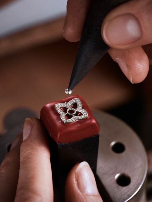 A natural diamond being set