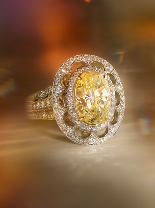Close up of a diamond ring featuring a Honey Desert diamond solitaire