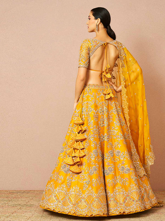 Model wearing a honey coloured lehenga