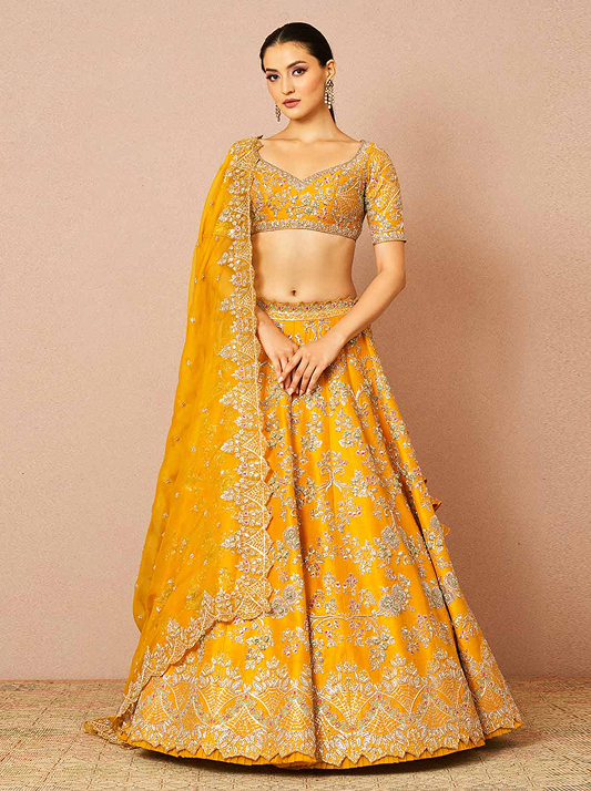 Model wearing a honey coloured lehenga