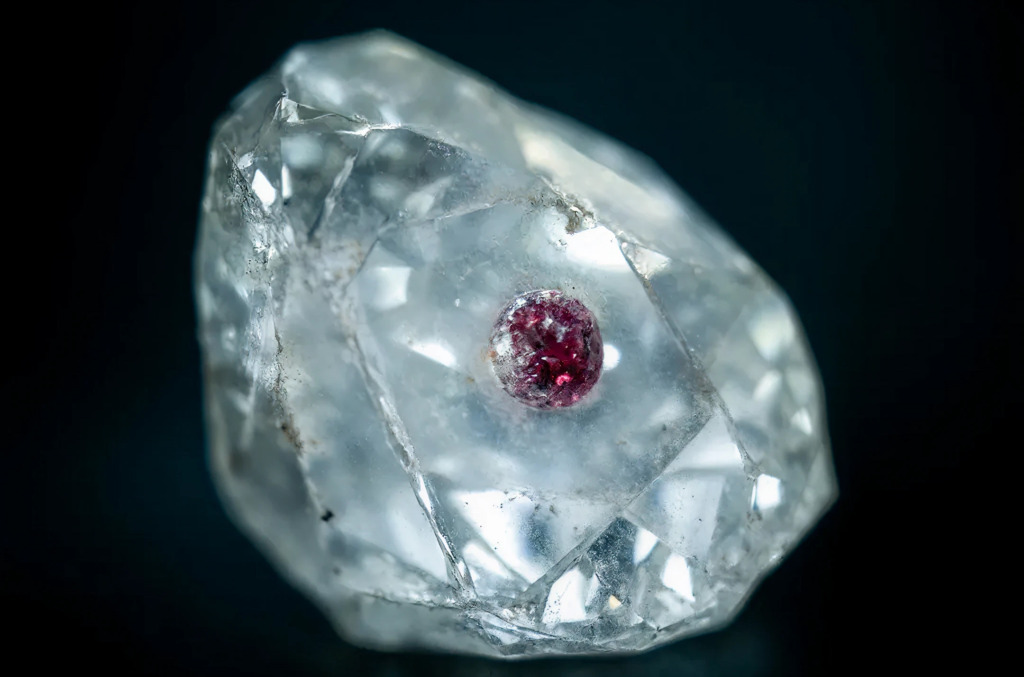 A natural diamond with a garnet inclusion