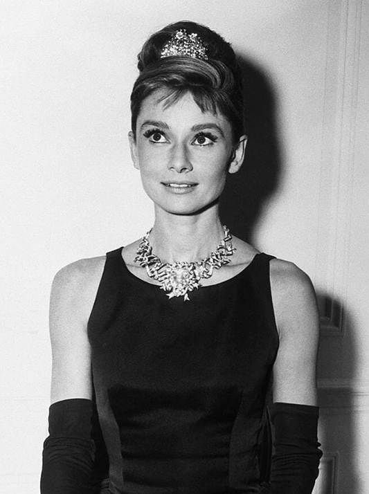 Audrey Hepburn wearing fancy coloured natural diamonds