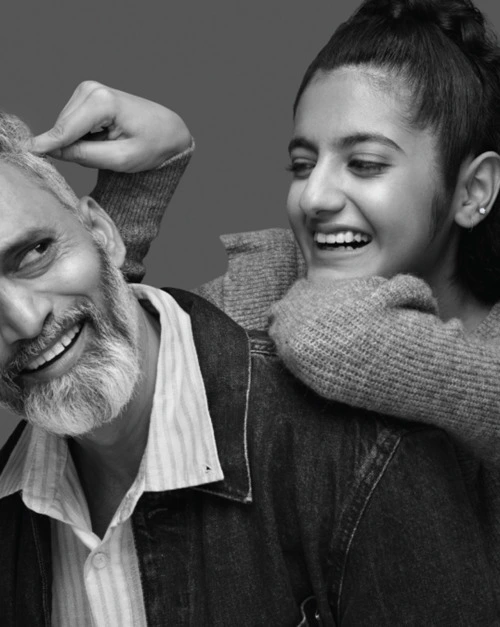 A black and white image of a dad and his daughter