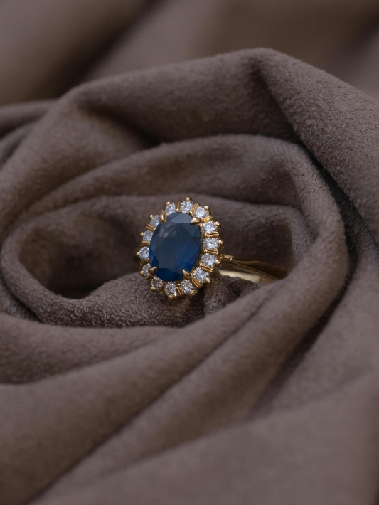 A sapphire ring encircled with small diamonds