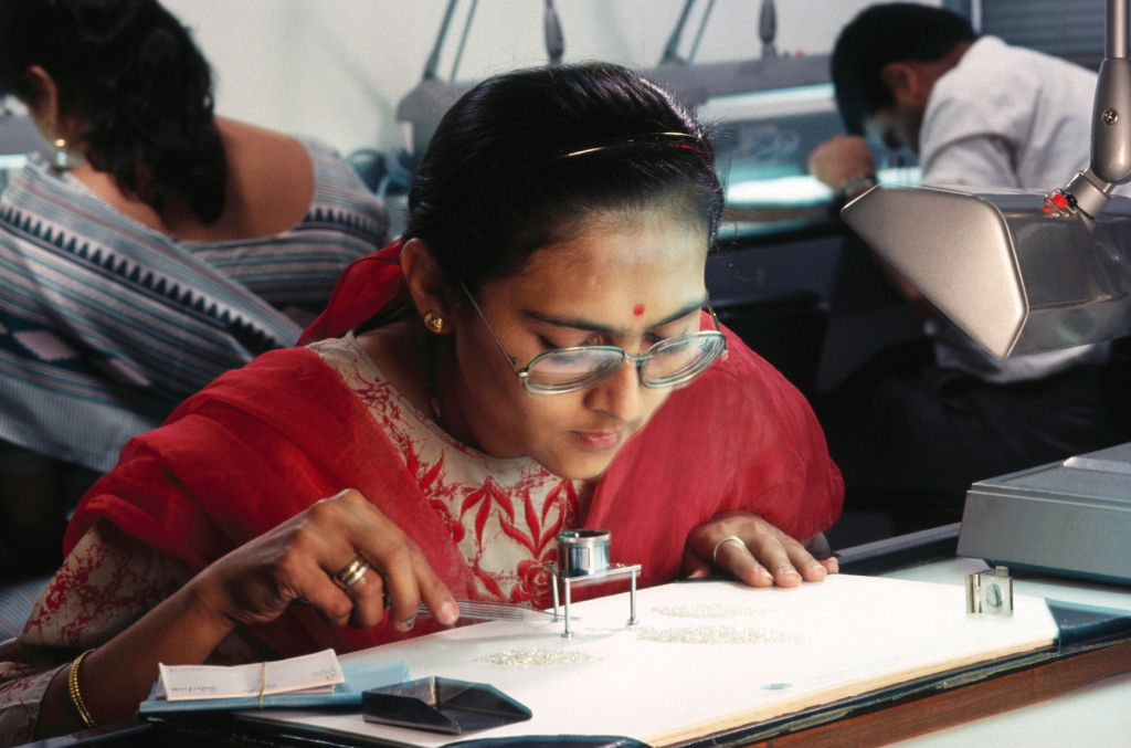 How Surat became the diamond capital of the world_Woman working on natural diamonds