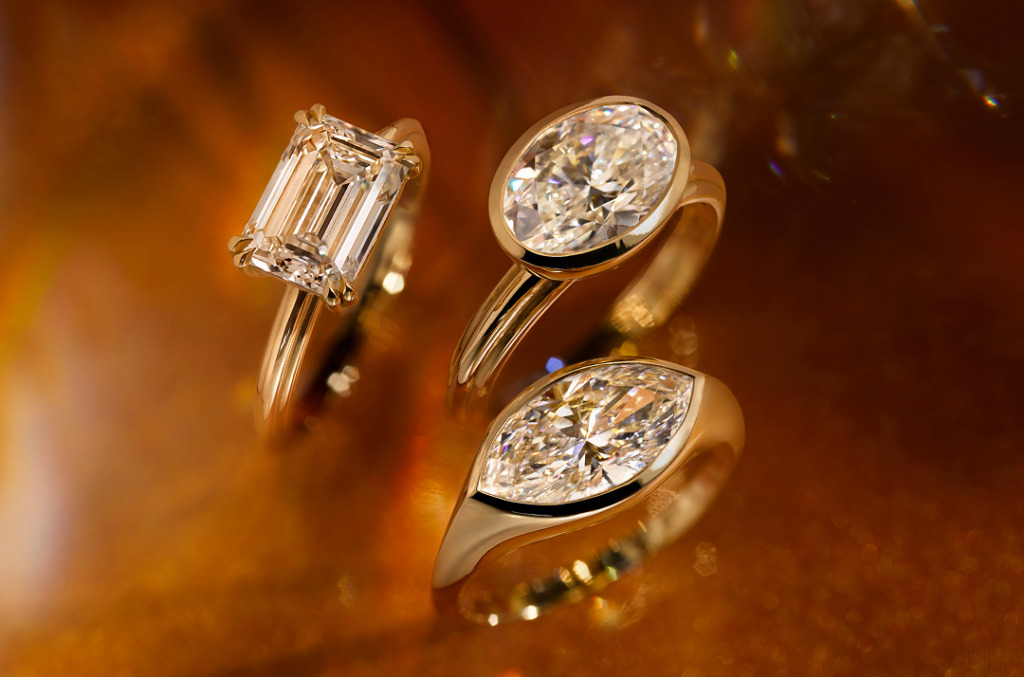 A trio of Sunlit white desert diamond solitaire rings