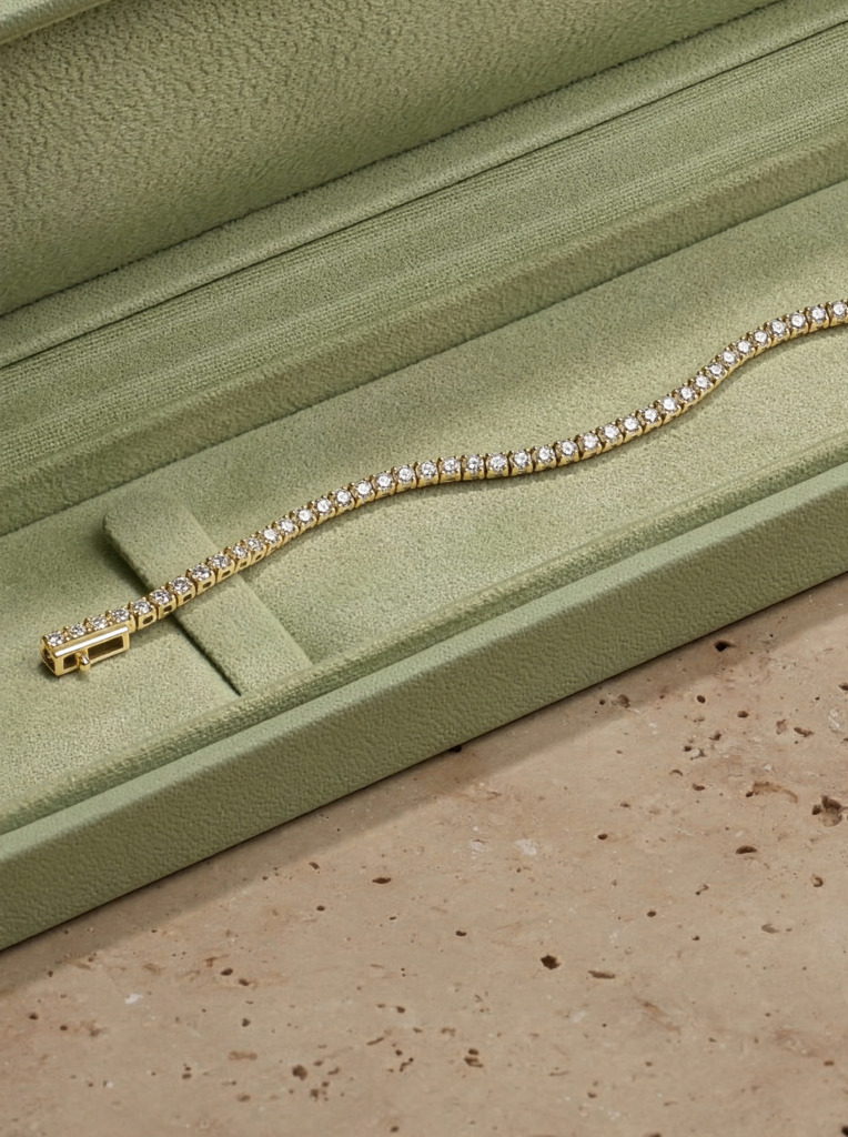 Close up of a natural diamond bracelet in a green jewellery box