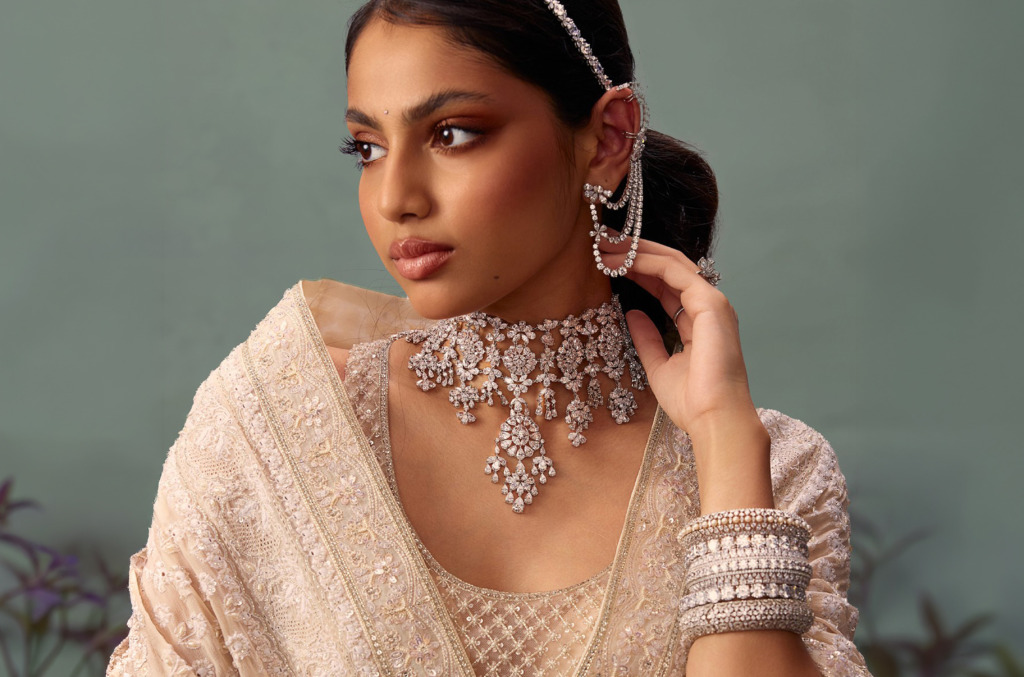 An Indian woman in festive attire wearing natural diamond jewellery