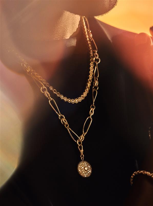 Necklaces top to bottom: Fortis Hexagon Necklace by KOLOURS; Twisted Link Cognac Diamond Pendant by Lucy Dellus