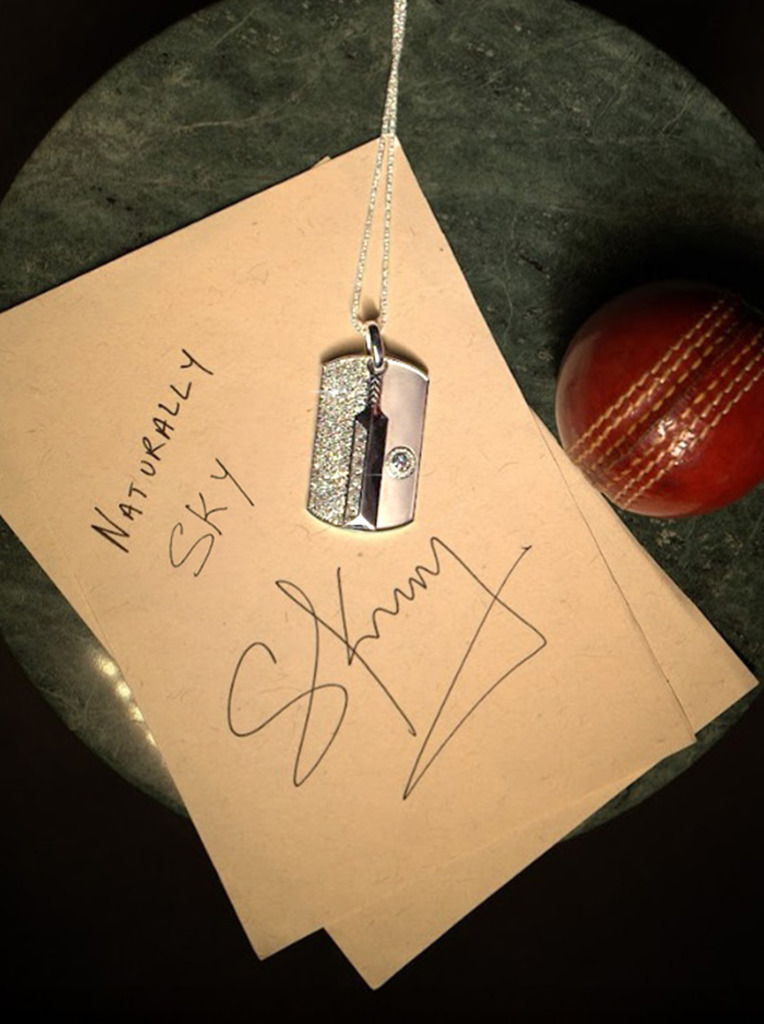 Suryakumar Yadav's custom De Beers diamond pendant along with a hand-signed note by the cricketer
