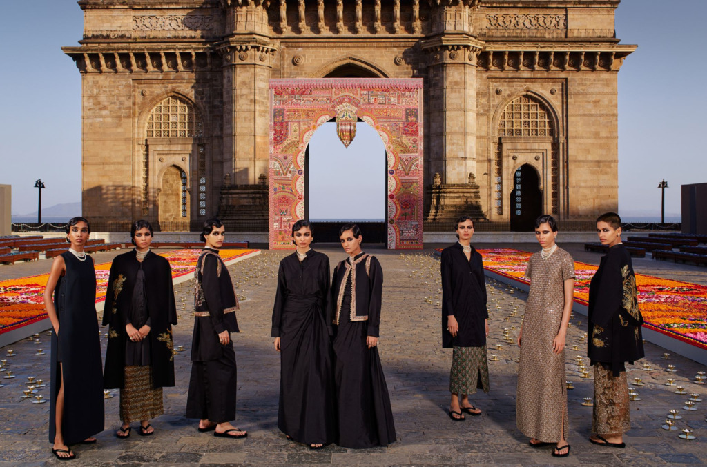 Models at the Dior Pre-Fall 2023 runway show in India at the Gateway of India monument in Mumbai