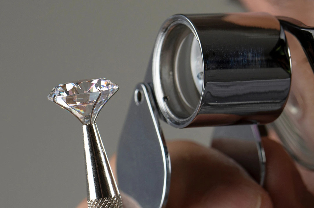 A person with a scope inspecting a natural diamond