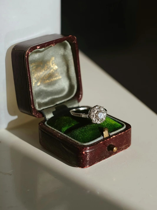 A vintage diamond engagement ring in its case