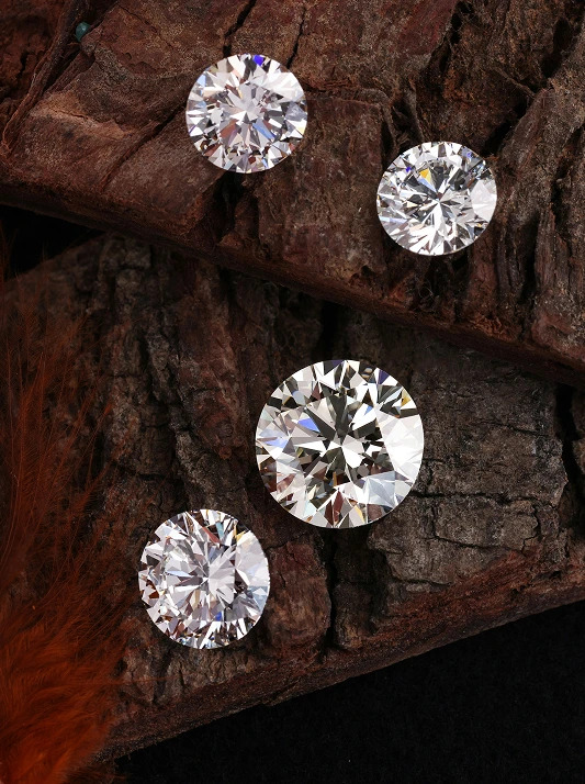 Loose diamonds against a wooden surface