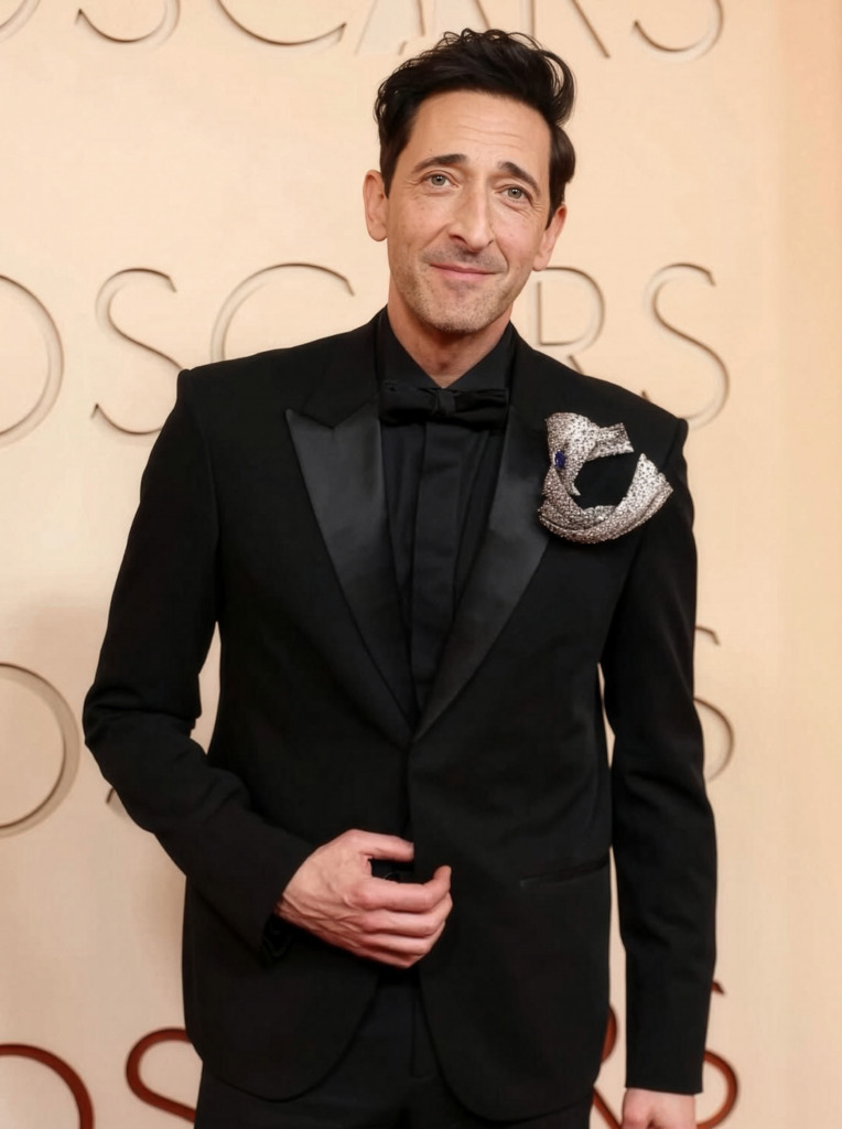 Actor Adrien Brody at the 2026 Oscars wearing a diamond brooch