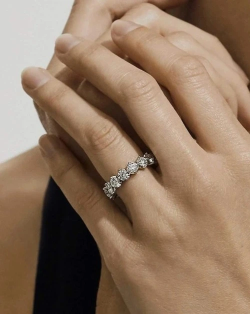 Close up of a natural diamond ring on a finger