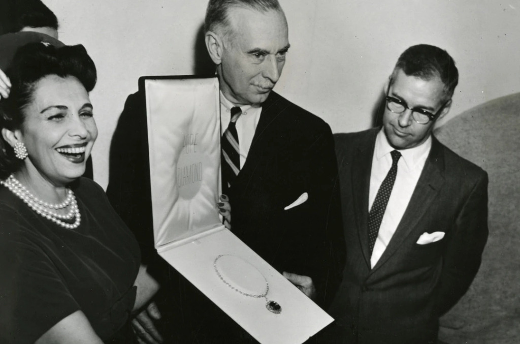 Jeweller Harry Winston presenting the Hope Diamond after acquiring it from the estate of American heiress Evalyn Walsh McLean in the mid-20th century.