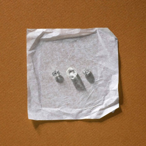 Diamonds on white square with rust background