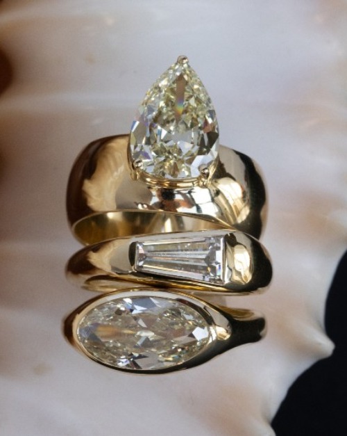 WWAKE gold and diamond rings on shell