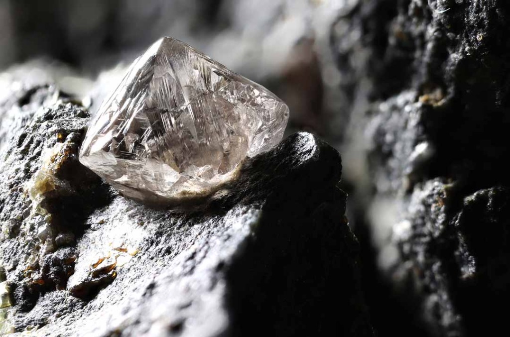 White rough diamond on magma rock