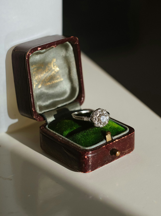 Diamond ring in brown leather ring box