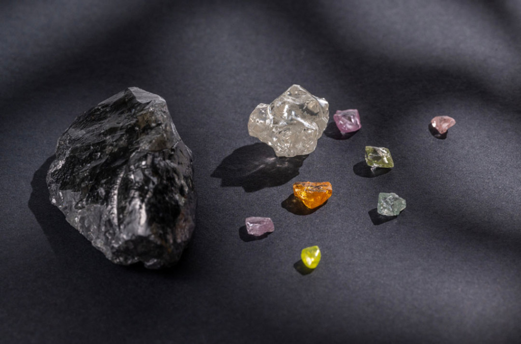 Colored diamonds next to a lump of magma