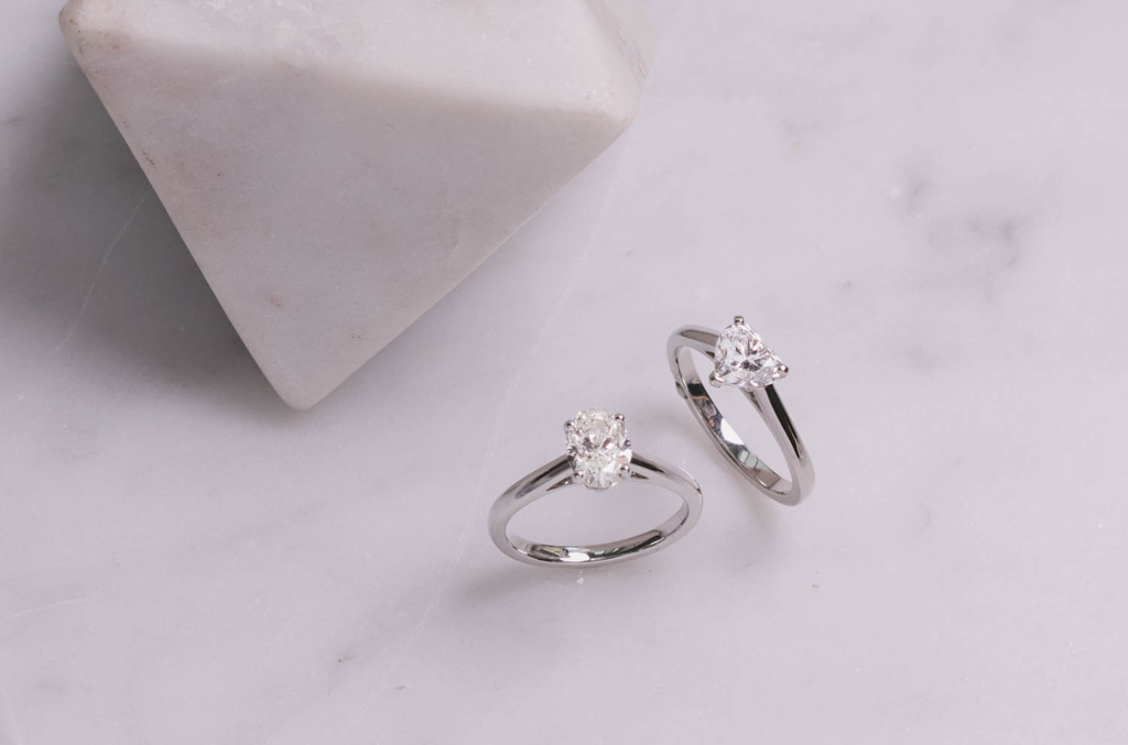 Two white diamond solitaire rings