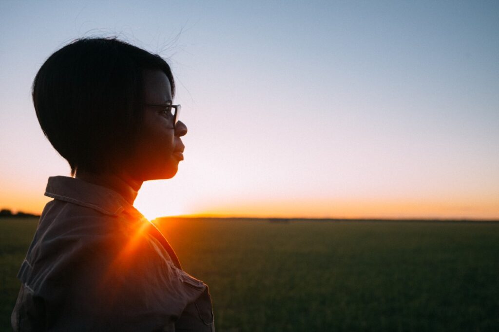 Woman staring into the sunset