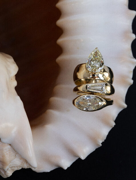 Natural diamond WWAKE ring on a shell