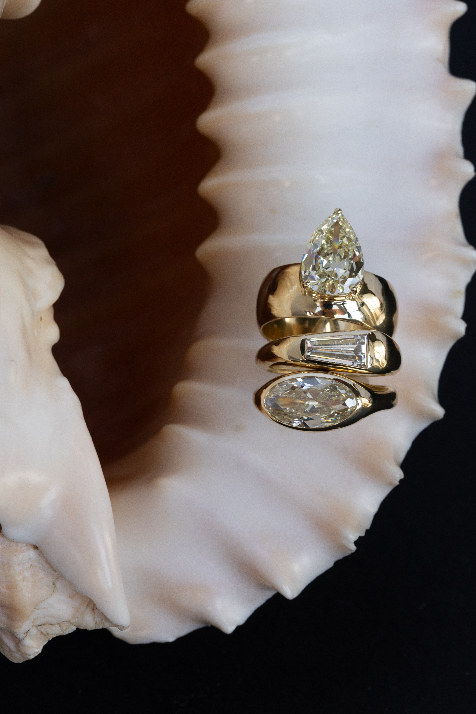 Natural diamond WWAKE ring on a shell