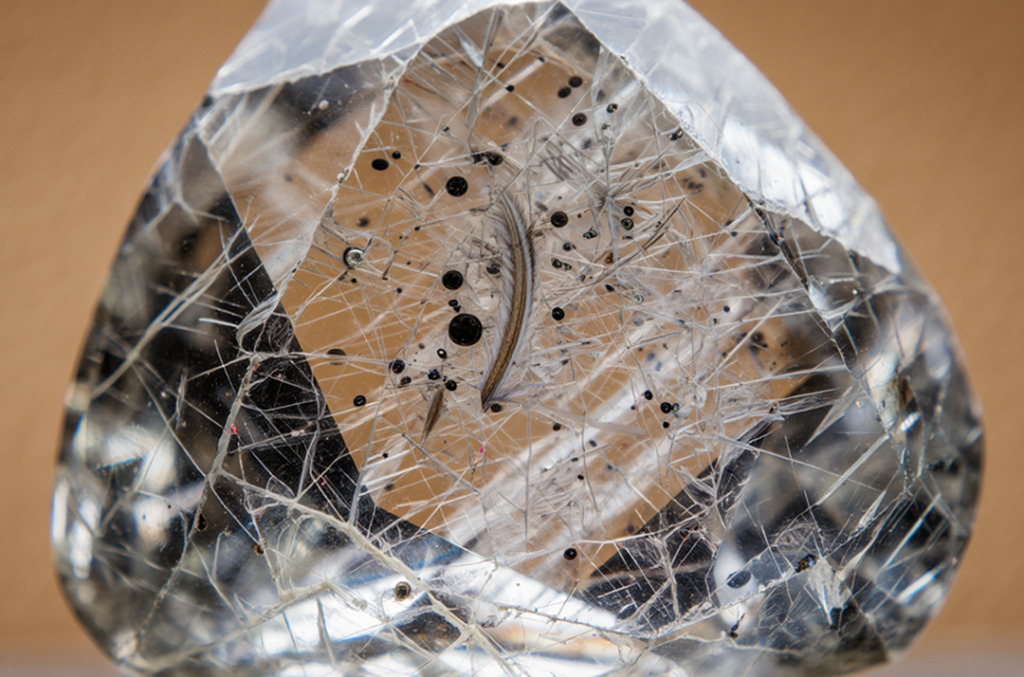 A raw diamond with inclusions and blemishes