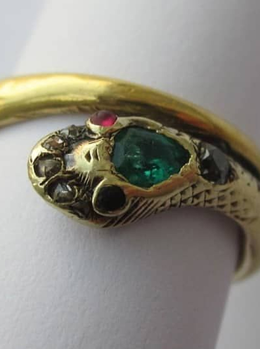 Queen Victoria's serpent-shaped gold ring adorned with rubies, emeralds and natural diamonds.