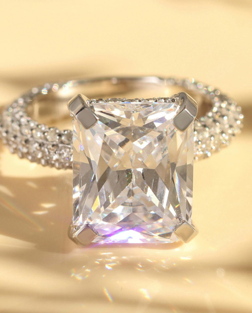 Natural diamond engagement ring on a neutral background