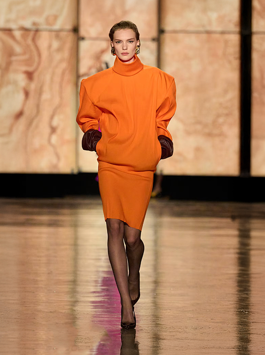 Runway image from Saint Laurent A/W 2025 showcasing ochre in fashion trends.