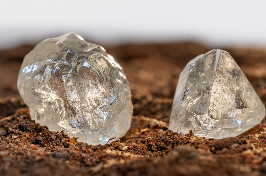 Rough natural diamonds pictured in soil
