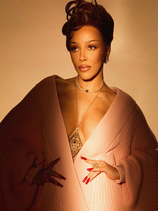 Doja Cat styled in a blush-toned ensemble accented with layered necklaces featuring Sunset Brown Desert diamonds.