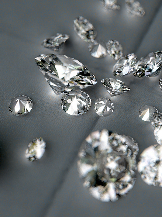 Round brilliant diamonds scattered across a silver grey background